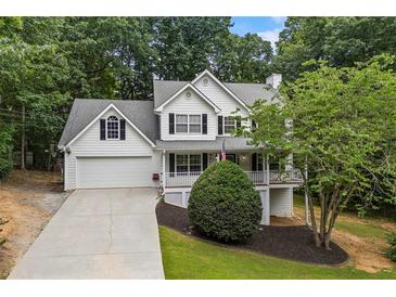 Charming two-story traditional home with a well-manicured lawn and attached two-car garage at 2990 Cove Crossing Dr, Lawrenceville, GA 30045