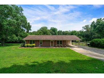 Charming single-story home featuring a well-maintained lawn and traditional brick exterior at 81 Laurie Ct, Hiram, GA 30141