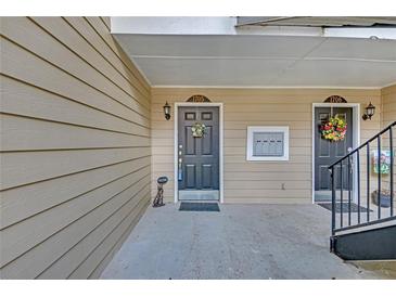 Inviting front entrances to units 1705 and 1706 offer welcoming decor and convenient mailbox access at 1705 Brighton Pt, Atlanta, GA 30328