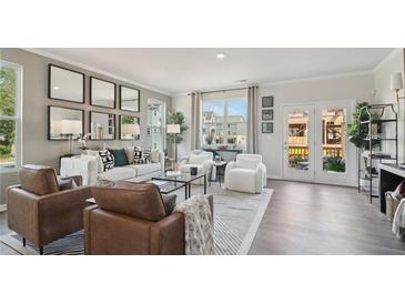 Bright living room with modern furniture and stylish decor, creating an inviting and comfortable space at 1305 Lakota Pl, Atlanta, GA 30315
