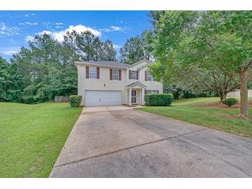 Charming two-story home with a well-maintained front yard and a classic suburban feel at 7459 Old Chapel, South Fulton, GA 30349