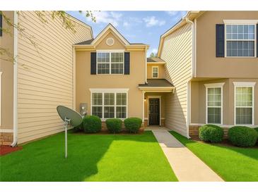 Charming two-story home with well-manicured lawn and inviting entrance at 7432 Battlecreek Ln, Jonesboro, GA 30236