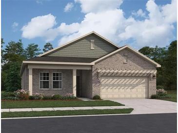 Charming single-story home featuring a brick facade, attached garage, and manicured landscaping at 329 Torcello Blvd, Mcdonough, GA 30253