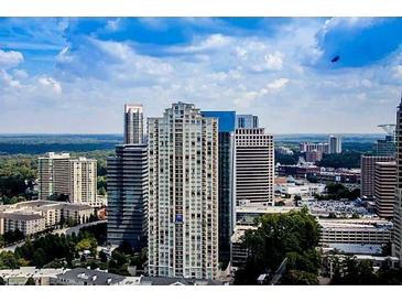 Expansive city view featuring high-rise buildings and lush green trees at 3445 Stratford Ne Rd # 2703, Atlanta, GA 30326