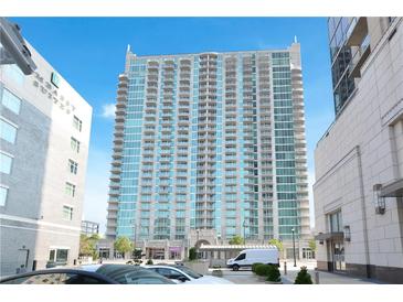 Luxury high-rise condo building featuring modern architecture and private balconies in a vibrant city location at 361 17Th Nw St # 1702, Atlanta, GA 30363