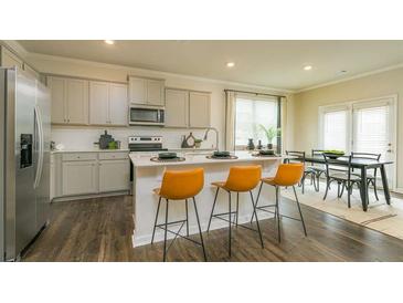 Modern kitchen features stainless steel appliances, a center island, and stylish seating at 3080 Yellowhammer Dr, Marietta, GA 30064
