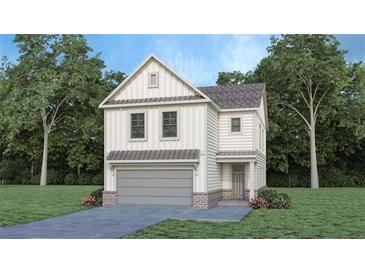 Charming two-story home featuring a modern farmhouse design with a gray garage door and well-manicured lawn at 6128 Knickerbocker St, Mableton, GA 30126