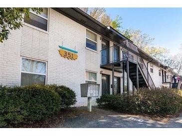 Apartment building featuring painted brick, traditional windows, and exterior stairs at 351 Cherokee Ave, Atlanta, GA 30312