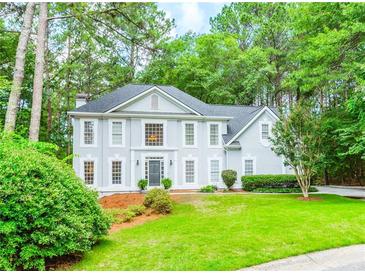 Charming two-story home with a manicured lawn and mature landscaping at 5396 Turnbill Nw Pt, Acworth, GA 30101