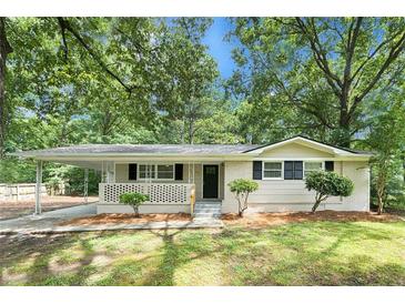 Charming single-story home featuring a front porch and carport at 1026 Eisenhower Se Ct, Atlanta, GA 30354