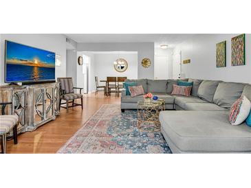 Inviting living room featuring hardwood floors, comfortable seating, and a modern entertainment center at 5145 Roswell Road # 3, Atlanta, GA 30342