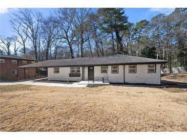 Charming brick home with updated landscaping and modern black trim at 2277 Cloverdale Se Dr, Atlanta, GA 30316