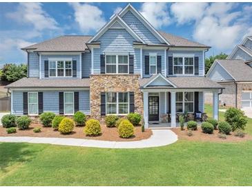 Charming two-story home with stone accents, manicured lawn, and classic curb appeal at 2953 Balvenie Pl, Acworth, GA 30101