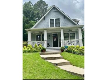 Charming craftsman-style home with welcoming front porch and well-manicured landscaping at 158 Delano Dr, Decatur, GA 30032
