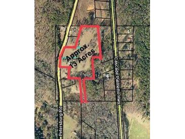 Aerial view of a large parcel of land with approximately 13 acres at 7000 Petersburg Rd, Fairburn, GA 30213