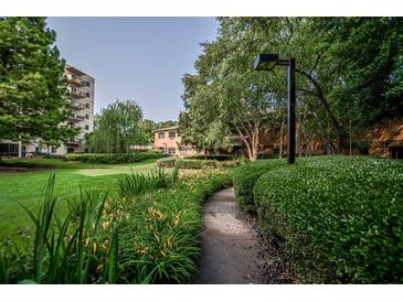 Beautifully landscaped grounds with manicured bushes and walking path at 1800 Clairmont Lk # A226, Decatur, GA 30033