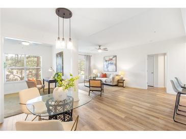 Bright living room featuring wood floors, modern lighting, and stylish furniture at 2700 Pine Tree Ne Rd # 2201, Atlanta, GA 30324