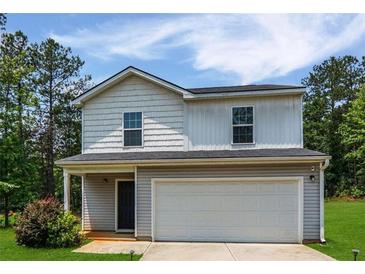 Charming two-story home featuring a two-car garage and well-maintained front yard and appealing color scheme at 20 Sloane Ct, Covington, GA 30016