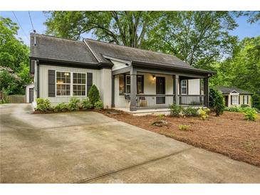 Charming bungalow with a welcoming front porch and well-maintained landscaping at 2201 Plantation Ln, Atlanta, GA 30341