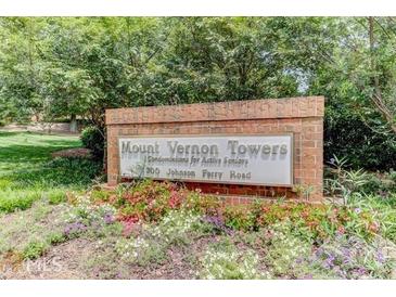 Mount Vernon Towers community sign for active seniors with colorful flowers in front at 300 Johnson Ferry Ne Rd # B604, Atlanta, GA 30328