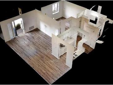 A 3D rendering showcases an apartment's layout, highlighting wood flooring, a kitchen with white cabinets, and natural light at 300 Johnson Ferry Ne Rd # B604, Atlanta, GA 30328