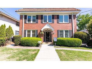 Charming brick two-story home with manicured lawn and inviting entryway at 824 Greenwood Ne Ave # 9, Atlanta, GA 30306