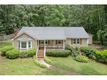 Charming single-story home with a well-maintained front yard and inviting porch at 1904 Britt Dr, Snellville, GA 30078