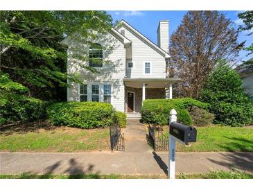 Charming two-story home with landscaped front yard and inviting entrance at 1995 Liberty Hts, Fairburn, GA 30213