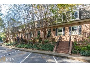 Charming brick townhomes featuring well-manicured landscaping and convenient parking at 1261 Lavista Ne Rd # M-4, Atlanta, GA 30324