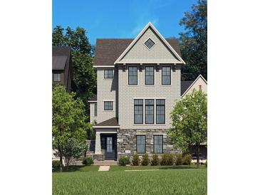 New construction home featuring stone accents, gray siding, a gable roof, and professional landscaping at 2210 Park Walke Dr, Alpharetta, GA 30009