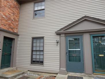 Two-story townhouse featuring a well-maintained exterior and inviting front door at 3083 Colonial Way # E, Atlanta, GA 30341