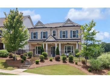 Charming two-story home with blue shutters, landscaped front yard, and inviting curb appeal at 3332 Old Concord Se Rd, Smyrna, GA 30082