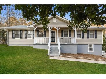 Charming ranch-style home with a welcoming front porch and a well-maintained lawn at 4631 Ben Hill Rd, Douglasville, GA 30134
