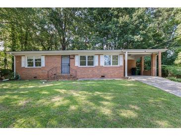 Charming single-story brick house featuring a well-maintained lawn and a convenient covered carport at 804 Brookdale Sw Dr, Atlanta, GA 30315