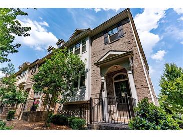 Beautiful brick townhome with well-manicured landscaping and charming entryway at 4020 Townsend Ln, Atlanta, GA 30346