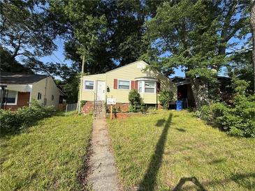 Charming one-story home with sidewalk and steps leading to a welcoming front entrance at 1106 Donnelly Sw Ave, Atlanta, GA 30310