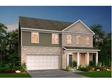 Charming two-story home with a brick and siding exterior, covered porch, and two-car garage at 6106 Marigold Way, Atlanta, GA 30349
