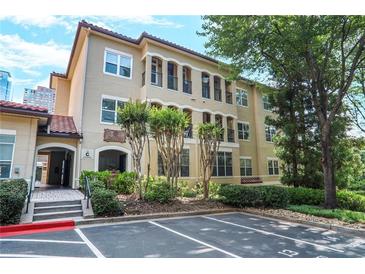 Charming condo building with well-maintained landscaping and assigned parking spaces for residents at 955 Juniper Ne St # 3331, Atlanta, GA 30309