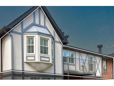A close up of the exterior of a Tudor-style apartment at 6851 Roswell Rd # G20, Sandy Springs, GA 30328