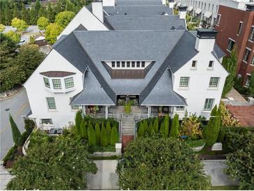 Stunning aerial view of this elegant home featuring a gray roof, white exterior, and meticulously landscaped surroundings at 201 Dovecrest Dr, Atlanta, GA 30305