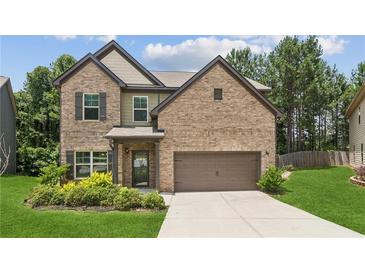 Charming two-story brick home with well-manicured lawn and attached two-car garage at 4967 Zoya Sw Ct, Atlanta, GA 30331