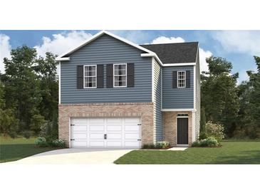 Charming two-story home with blue siding, brick accents, and a two-car garage at 5451 Baybrook Cir, South Fulton, GA 30349