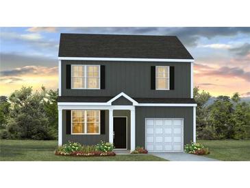 Charming two-story home featuring dark siding, white trim and a one car garage at 5449 Baybrook Cir, South Fulton, GA 30349