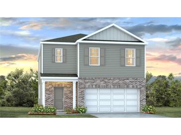 Charming two-story home featuring gray siding, brick accents, and a two-car garage at 5455 Baybrook Cir, South Fulton, GA 30349