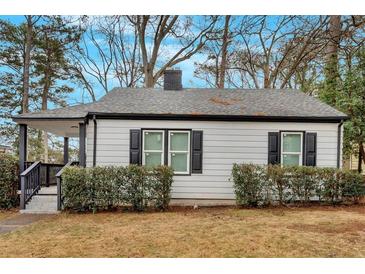 Charming single-story home featuring a cozy front porch and well-maintained landscaping at 1222 E Forrest Ave, Atlanta, GA 30344