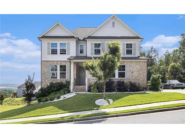 Charming two-story home with a brick and siding exterior, landscaped yard, and inviting front porch at 25 Running Terrace Way, Cartersville, GA 30121