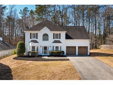 Beautiful two-story home with a well-maintained lawn and a two-car garage at 3519 Wellsley Dr, Powder Springs, GA 30127