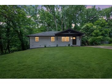 Charming home showcasing a freshly manicured front yard and modern exterior design at 1733 Hollyhock Ter, Decatur, GA 30032