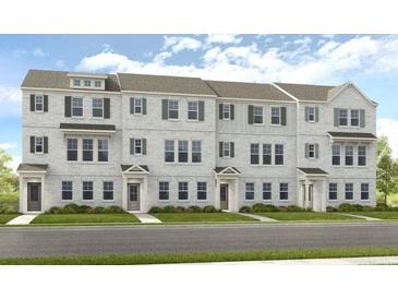 Attractive brick townhome exterior featuring symmetrical design and well-manicured landscaping at 206 Maycrest Path, Tucker, GA 30084