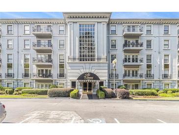 Beautiful condominium complex featuring a well maintained facade and manicured landscaping at 3201 Lenox Ne Rd # 23, Atlanta, GA 30324